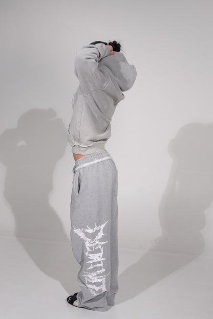GREY CRACKED LOGO PANTS